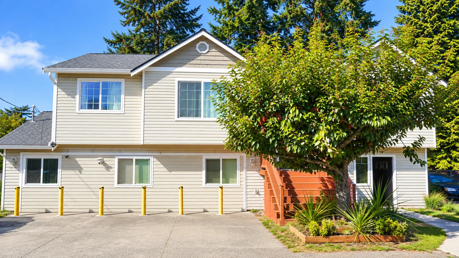 The parking area beside Prime Adult Family Home, with a level paved approach to the entrance